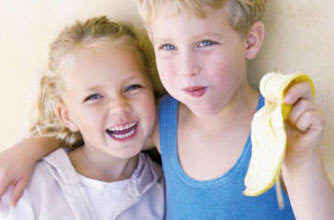 Children eating a banana