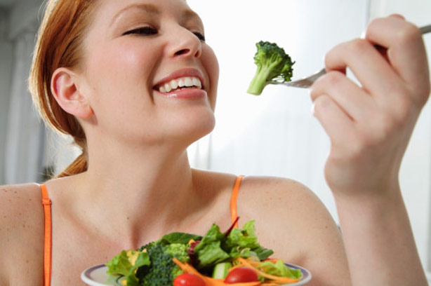 A woman eating a salad