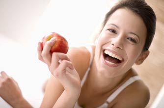 A woman eating an apple