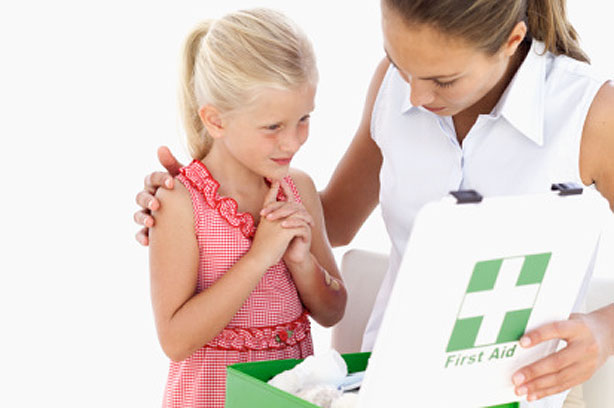 Child with first aid box