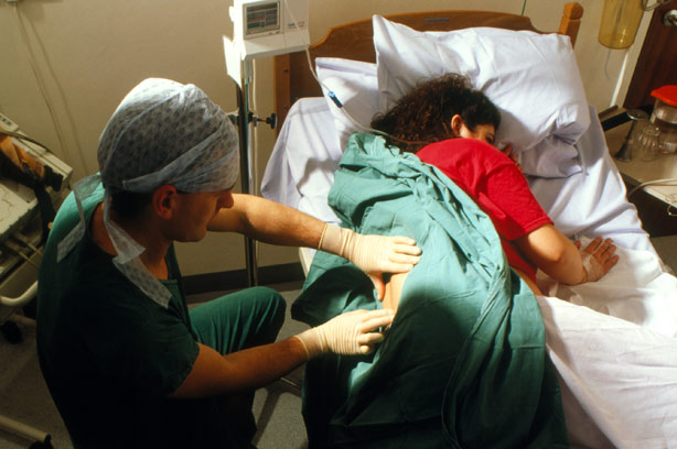 Woman having an epidural Woman having an epidural