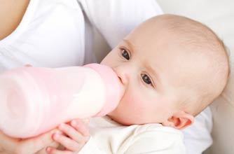 Baby being bottle fed Baby being bottle fed