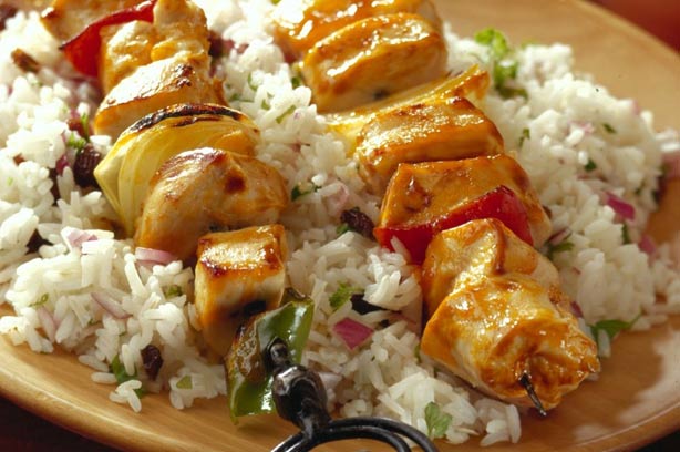 Chicken kebabs on jewelled rice