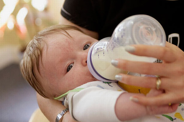 Breastfeeding not for me woman bottle feeding baby