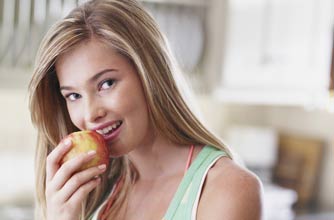 A girl eating an apple
