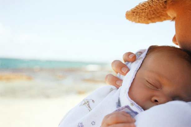 Baby protect sun woman