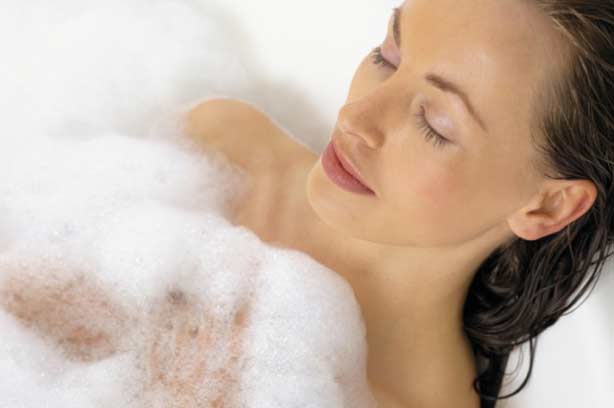 A woman relaxing in the bath A woman relaxing in the bath