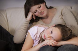 Mum comforting her daughter