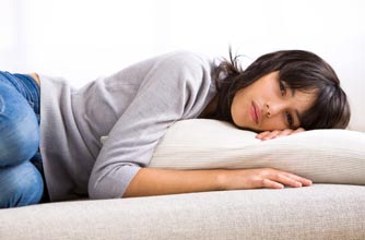 Teen girl lying on the sofa