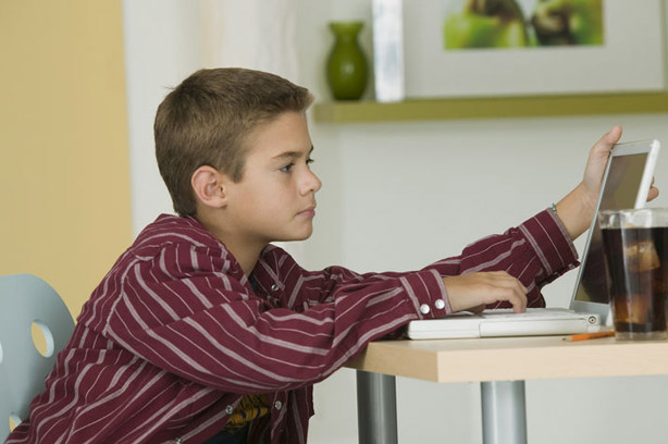 Pre-teen dealing with online bullying child computer internet