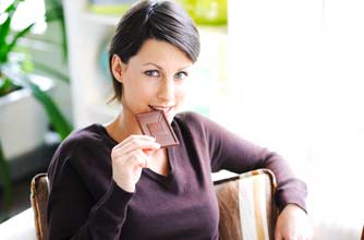 Woman eating chocolate