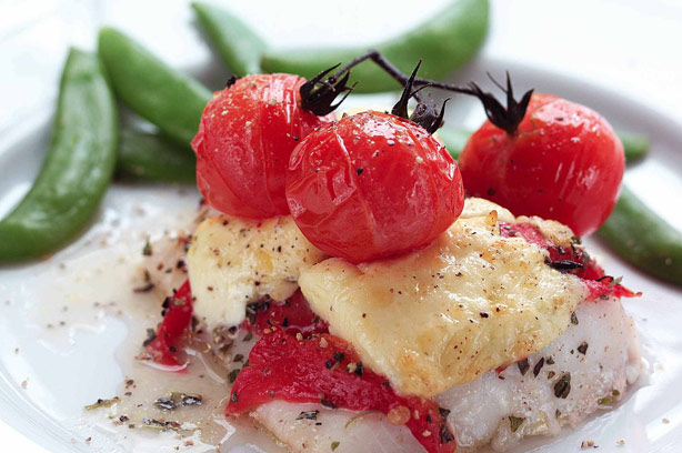 Roasted haddock with Cheshire cheese and vine tomatoes
