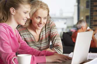 Mum and daughter on a laptop