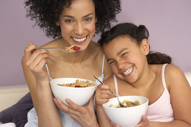 mother daughter eating cereal happy breakfast mother daughter eating cereal happy breakfast