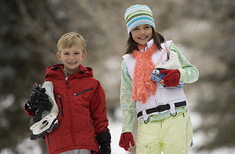 A brother and sister ice skating