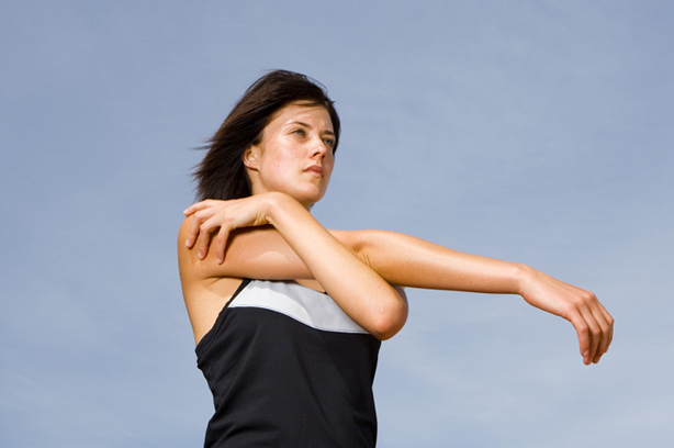 A woman stretching herr arm A woman stretching herr arm