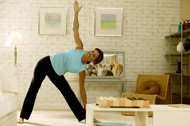 Woman trying Yoga at home Woman trying Yoga at home