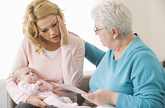New mum with baby seeing a midwife