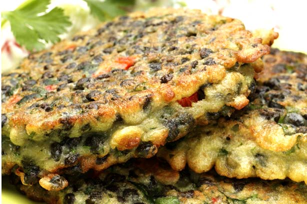 Lentil fritters with spring onion and cherry tomato raita