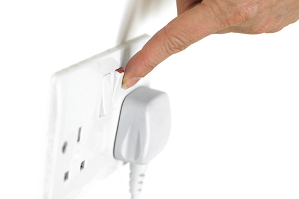 Person turning on plug
