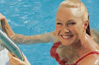 Lady swimming in swimming pool