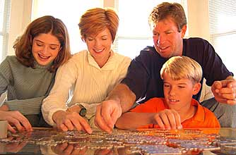 A family doing a jigsaw together