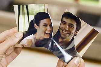 a torn photo symbolising a split a torn photo symbolising a split