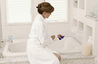 A woman running a bath A woman running a bath
