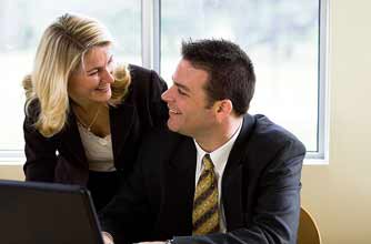 Man and woman flirting at work_jupiter Man and woman flirting at work_jupiter