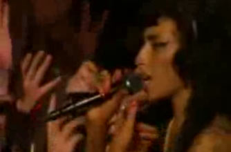 Watch Amy Winehouse punch a fan at Glastonbury