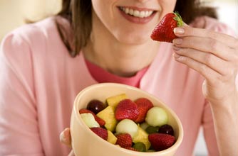 Woman with bowl of berries