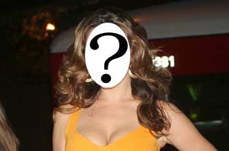 Kelly Brook has been caught chatting on her mobile phone while driving