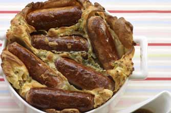 Toad in the hole with sage batter and onion gravy Toad in the hole with sage batter and onion gravy