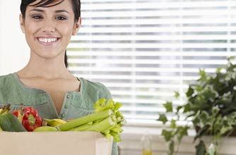 Woman with bag of vegetables