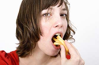 A woman eating junk food
