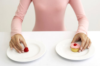 Woman with cake and berry Woman with cake and berry