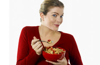 Woman eating cereal