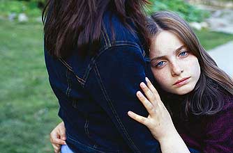 A girl hugging her mum