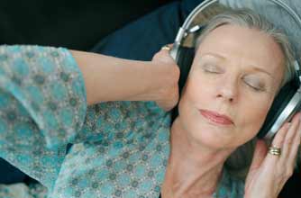 older woman listening to music_Photolibrary