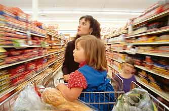 Mum in a supermarket with kids_rex