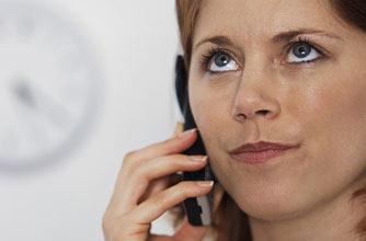 A woman getting annoyed on the phone