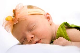 cute baby girl asleep_istock
