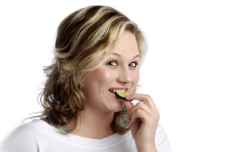  Woman happy and eating_istockphoto