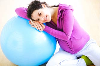 Pregnant woman hugging ball Pregnant woman hugging ball