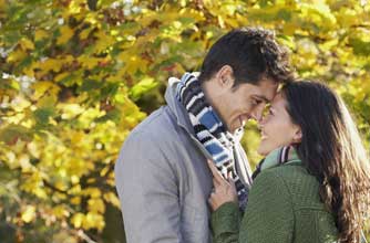 Couple cuddling outside in autumn_rex