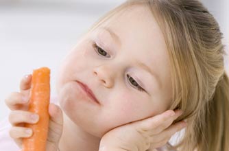 Little girl holding a carrot Little girl holding a carrot