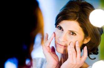 Woman looking in mirror