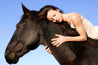 Woman sleeping on a horse