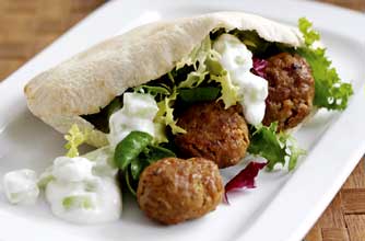 Baked meatballs with grilled pitta breads and tzatziki