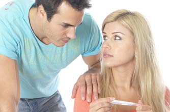Couple looking at a pregnancy test